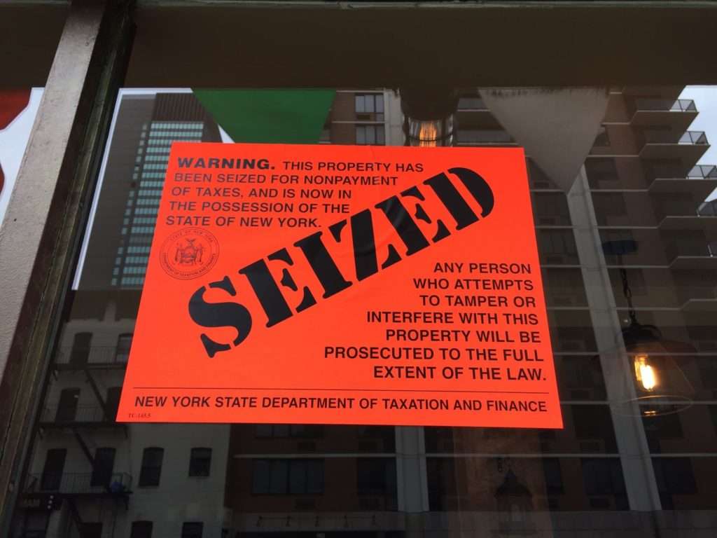 Civil Asset Forfeiture Sign on a business